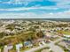 Aerial view of a residential neighborhood with houses and lush green landscape at 9105 Flagstick Ln, Hudson, FL 34667