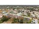 Aerial perspective of a residential area featuring numerous homes and well-maintained streets at 9105 Flagstick Ln, Hudson, FL 34667
