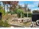 Landscaped backyard with fire pit and seating area at 9105 Flagstick Ln, Hudson, FL 34667