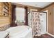 Bathroom with soaking tub and walk-in shower at 9105 Flagstick Ln, Hudson, FL 34667