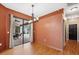 Bright dining room with wood floors and access to the patio at 9105 Flagstick Ln, Hudson, FL 34667