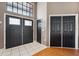 Elegant entryway with double doors and hardwood flooring at 9105 Flagstick Ln, Hudson, FL 34667