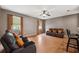 Relaxing Gathering room with leather seating and hardwood floors at 9105 Flagstick Ln, Hudson, FL 34667