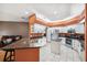 Kitchen with island, granite countertops, and stainless steel appliances at 9105 Flagstick Ln, Hudson, FL 34667