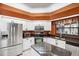 Kitchen features stainless steel appliances and granite countertops at 9105 Flagstick Ln, Hudson, FL 34667