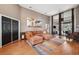 Spacious living room with hardwood floors and large windows at 9105 Flagstick Ln, Hudson, FL 34667