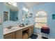 Double vanity bathroom with marble countertop and large shower at 9639 Conservation Dr, New Port Richey, FL 34655