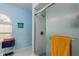 Bathroom with shower and decorative tile at 9639 Conservation Dr, New Port Richey, FL 34655