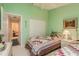 Guest bedroom with two twin beds and access to a hallway at 9639 Conservation Dr, New Port Richey, FL 34655