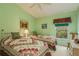 Guest bedroom with two twin-size beds, and a ceiling fan at 9639 Conservation Dr, New Port Richey, FL 34655