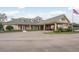Community clubhouse with welcoming entryway and ample parking at 9639 Conservation Dr, New Port Richey, FL 34655
