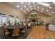 Spacious dining room with multiple tables and chairs at 9639 Conservation Dr, New Port Richey, FL 34655