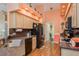 Bright kitchen with light wood cabinets, granite countertops, and modern appliances at 9639 Conservation Dr, New Port Richey, FL 34655