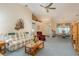 Bright living room with hardwood floors and a view into the dining area at 9639 Conservation Dr, New Port Richey, FL 34655