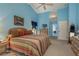 Main bedroom with king-size bed and access to bathroom and secondary bedroom at 9639 Conservation Dr, New Port Richey, FL 34655