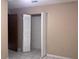 Bedroom with bifold closet doors at 10190 Thayer St, Brooksville, FL 34601