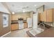 View of kitchen with stainless steel appliances and light wood cabinets at 11076 Addison St, Spring Hill, FL 34609