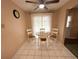 Small dining area with round table and four chairs at 11141 Sandtrap Dr, Port Richey, FL 34668