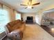 Relaxing living room with large windows and seating at 11141 Sandtrap Dr, Port Richey, FL 34668