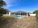 Relaxing screened pool area with grassy backyard at 11310 Palomar St, Spring Hill, FL 34609