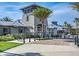 Gated entrance to community with landscaping and modern architecture at 11928 Sand Myrtle Rd, Riverview, FL 33579