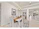 Elegant dining room with white table, chandelier, and access to backyard at 11928 Sand Myrtle Rd, Riverview, FL 33579