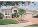 Single-story house with a two-car garage and landscaped front yard at 11928 Sand Myrtle Rd, Riverview, FL 33579