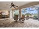 Spacious screened patio with view into the main bedroom and backyard at 12219 Arron Ter, Trinity, FL 34655