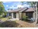 Backyard view of a condo with patio and AC unit at 1355 Powderpuff Dr # 908, Dunedin, FL 34698