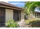 Condo backyard with sliding glass door access at 1355 Powderpuff Dr # 908, Dunedin, FL 34698