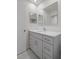 Modern bathroom vanity with gray cabinets and quartz countertop at 1355 Powderpuff Dr # 908, Dunedin, FL 34698