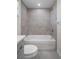 Newly remodeled bathroom with a tub and shower at 1355 Powderpuff Dr # 908, Dunedin, FL 34698