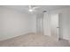 Primary bedroom with ceiling fan and walk-in closet at 1355 Powderpuff Dr # 908, Dunedin, FL 34698