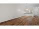 Dining room with vaulted ceiling, light walls and wood-look floors at 1355 Powderpuff Dr # 908, Dunedin, FL 34698