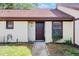 Front view of condo, showing entrance and walkway at 1355 Powderpuff Dr # 908, Dunedin, FL 34698