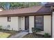 Front view of condo with entrance and walkway at 1355 Powderpuff Dr # 908, Dunedin, FL 34698