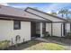 Condo exterior with entrance and landscaping at 1355 Powderpuff Dr # 908, Dunedin, FL 34698