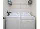 Stackable washer and dryer in a laundry closet at 1355 Powderpuff Dr # 908, Dunedin, FL 34698