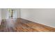 Living room featuring wood-look flooring and sliding glass doors at 1355 Powderpuff Dr # 908, Dunedin, FL 34698