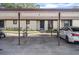 Covered parking carport for condo building at 1355 Powderpuff Dr # 908, Dunedin, FL 34698