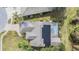 Aerial view of house, solar panels, and pool at 1413 Morning Rose Pl, Trinity, FL 34655