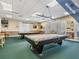 Two billiard tables are available in this well-lit game room at 1413 Morning Rose Pl, Trinity, FL 34655