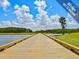 Picturesque wooden bridge over water on golf course at 1413 Morning Rose Pl, Trinity, FL 34655