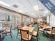 Community card room with tables and chairs for residents at 1413 Morning Rose Pl, Trinity, FL 34655