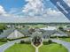Community clubhouse with pool and surrounding landscape at 1413 Morning Rose Pl, Trinity, FL 34655