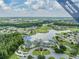 Aerial view of community clubhouse and golf course at 1413 Morning Rose Pl, Trinity, FL 34655