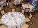 Elegant dining room featuring multiple tables with white linens at 1413 Morning Rose Pl, Trinity, FL 34655
