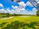 Scenic golf course with water features and lush fairways at 1413 Morning Rose Pl, Trinity, FL 34655