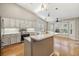 Updated kitchen with stainless steel appliances and an island at 1413 Morning Rose Pl, Trinity, FL 34655