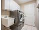 Laundry room with washer, dryer and utility sink at 1413 Morning Rose Pl, Trinity, FL 34655